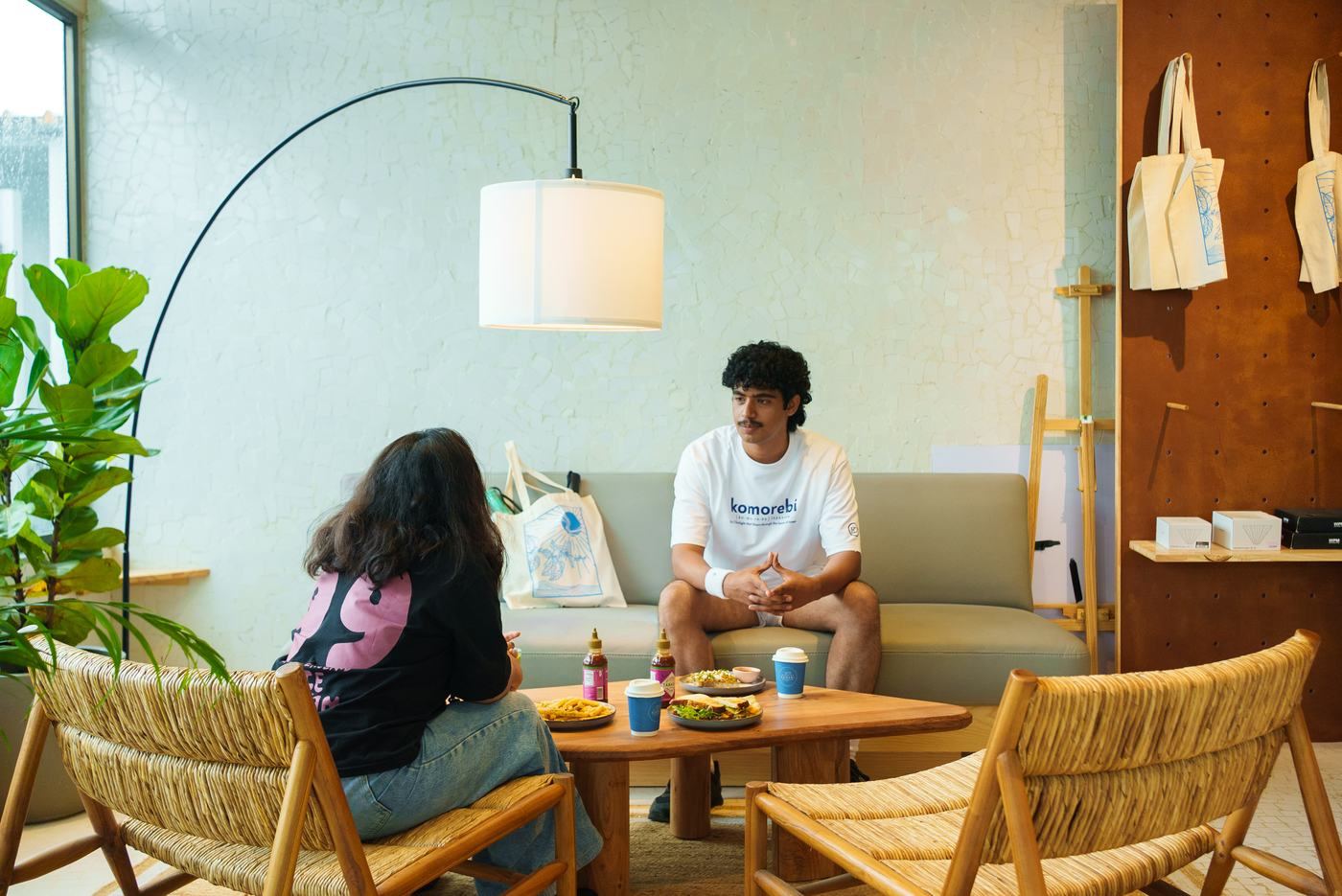 Two guests talking over coffee and toast at a Korebi × Terra table